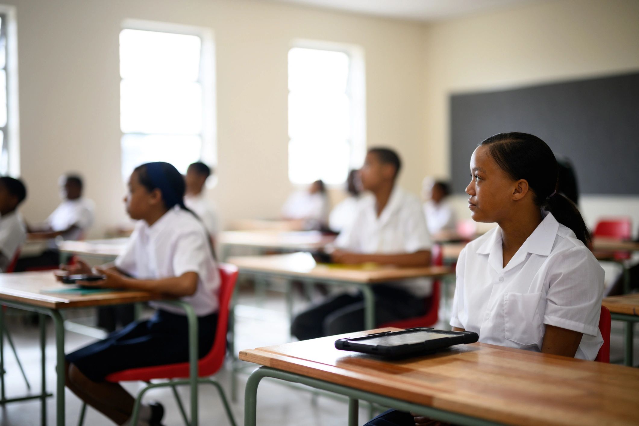 Students using digital tablets in class