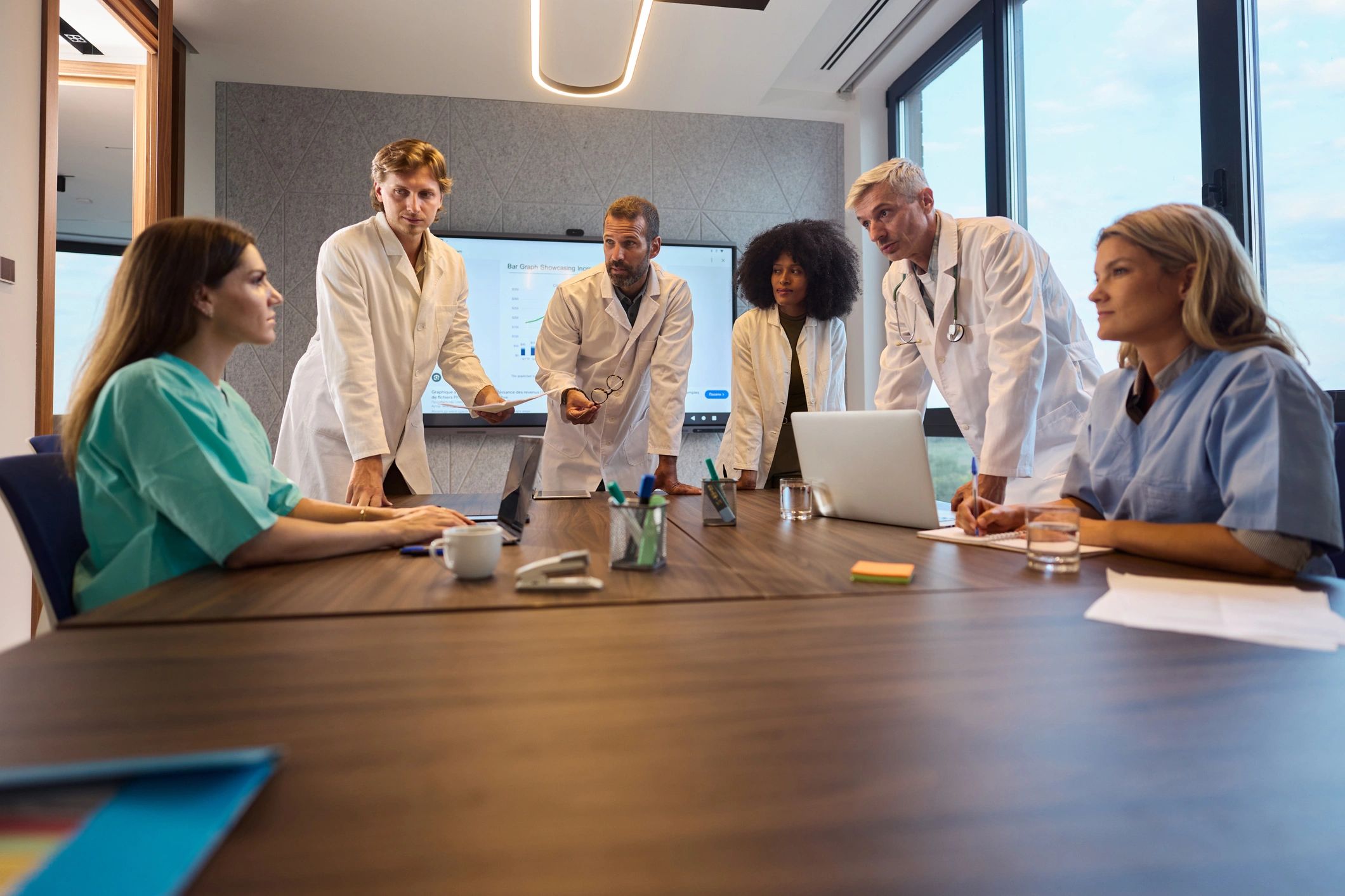 Healthcare technology team meeting in a hospital office