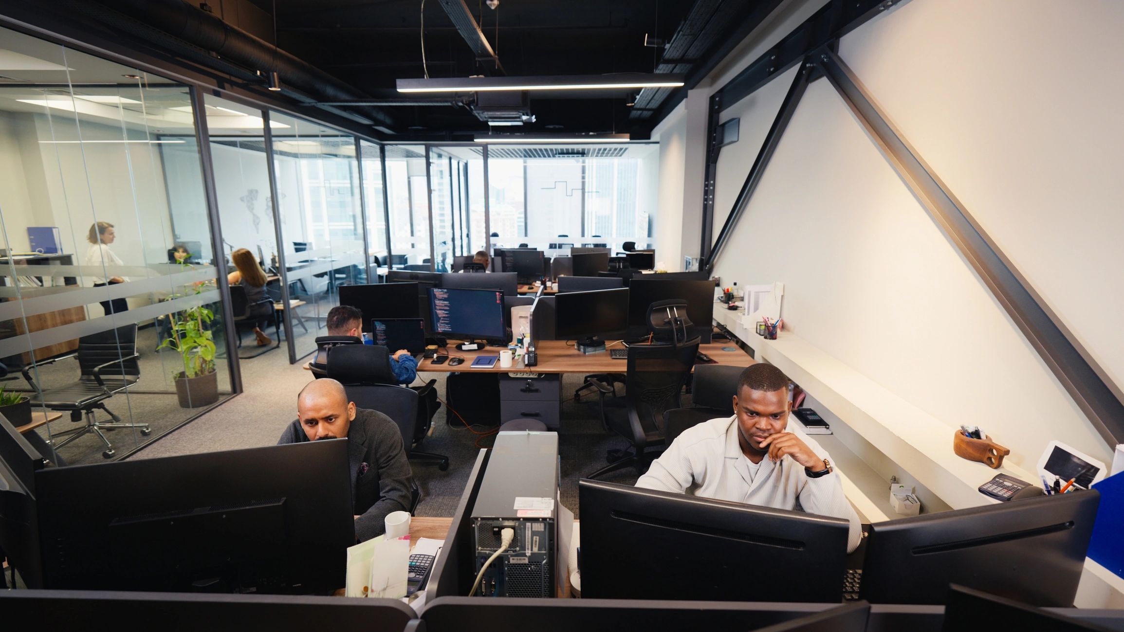 Professionals collaborating in a modern cybersecurity operations environment